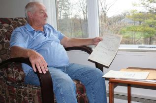 Bob Stinson remembering the Cuban Missile Crisis in the common room at The Meadowbrook seniors apartment building where he lives in Sydenham. Photo/Craig Bakay